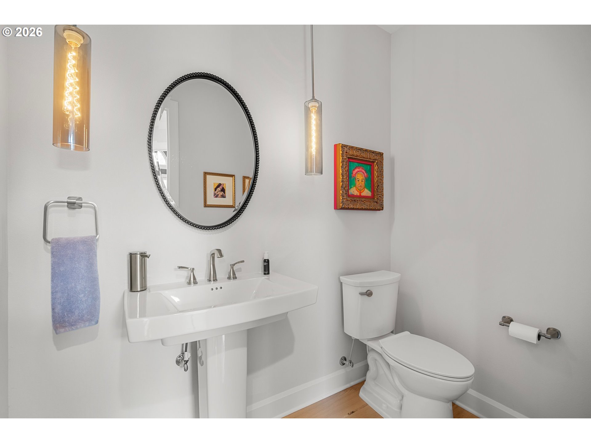 1716 Northwest Mill Pond Road Portland, OR 97229 - Photo 23 of 48 a bathroom with a toilet a sink and a mirror