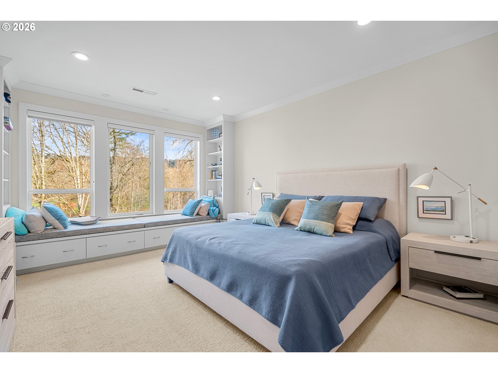 1716 Northwest Mill Pond Road Portland, OR 97229 - Photo 24 of 48 a bedroom with a large bed and a large window