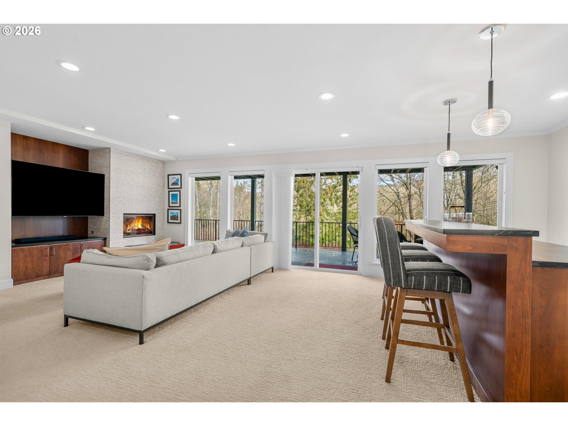 1716 Northwest Mill Pond Road Portland, OR 97229 - Photo 30 of 48 a living room with furniture and a flat screen tv