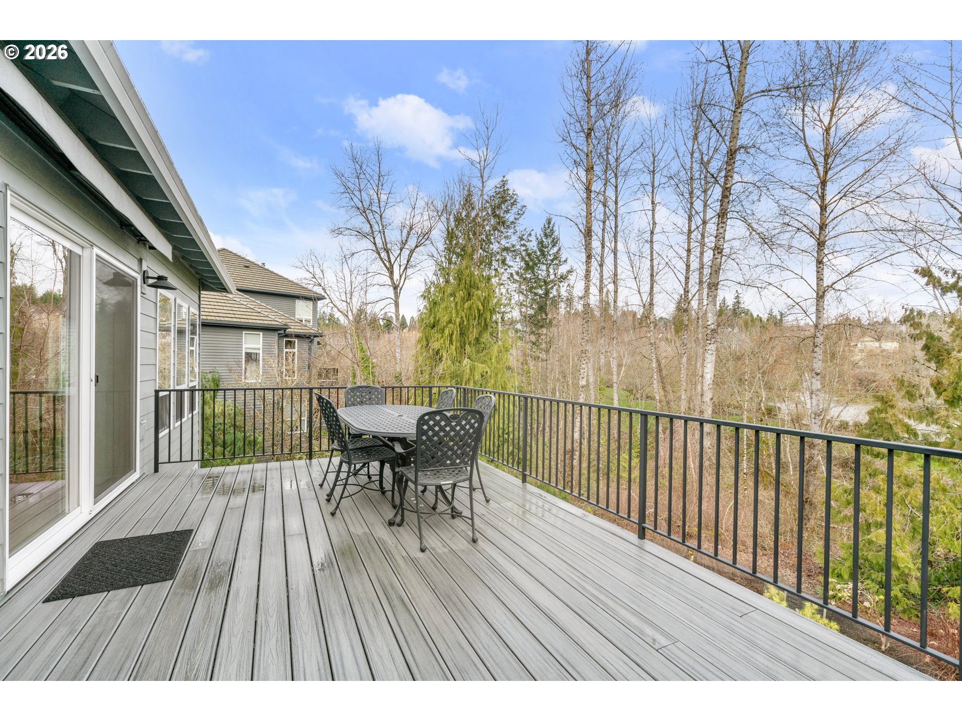 1716 Northwest Mill Pond Road Portland, OR 97229 - Photo 42 of 48 a balcony with table and chairs