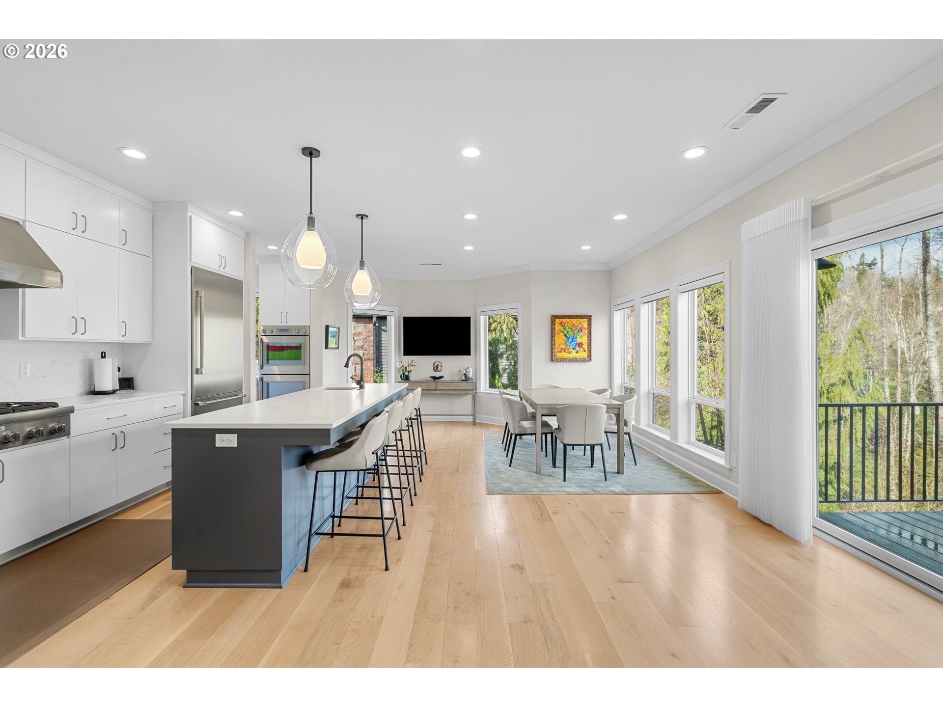 1716 Northwest Mill Pond Road Portland, OR 97229 - Photo 8 of 48 a living room with stainless steel appliances furniture a kitchen view and a large window