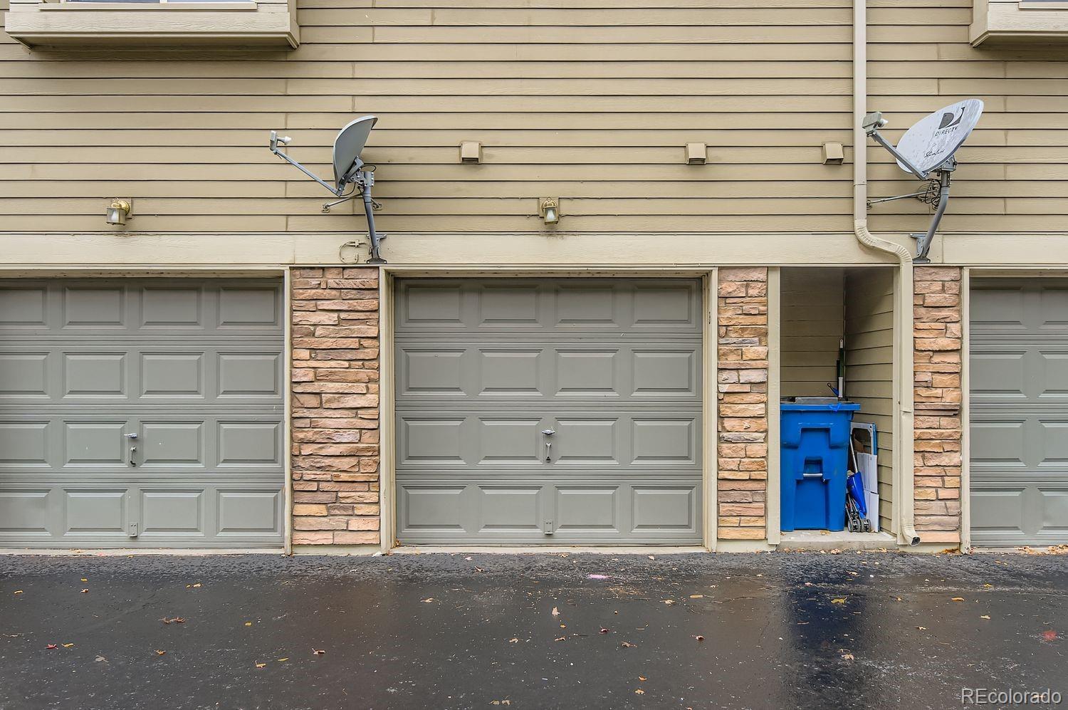 3261 South Waco Court, Unit B Aurora, CO 80013 - Photo 17 of 21 a front view of a house with a garage
