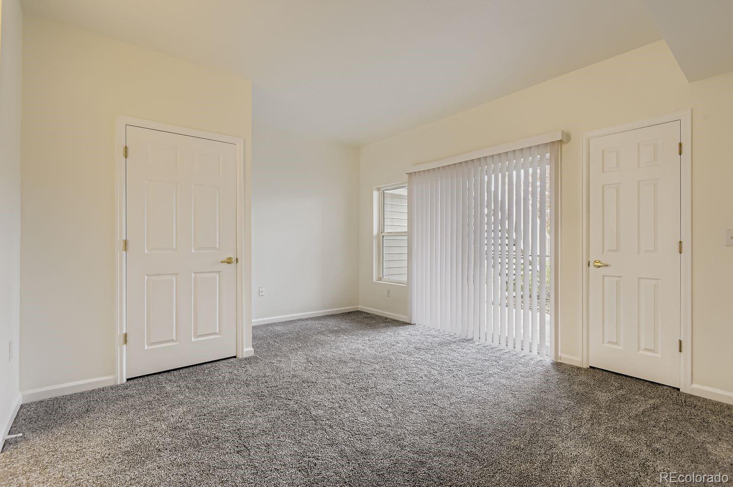 3261 South Waco Court, Unit B Aurora, CO 80013 - Photo 8 of 21 a view of an empty room and closet area