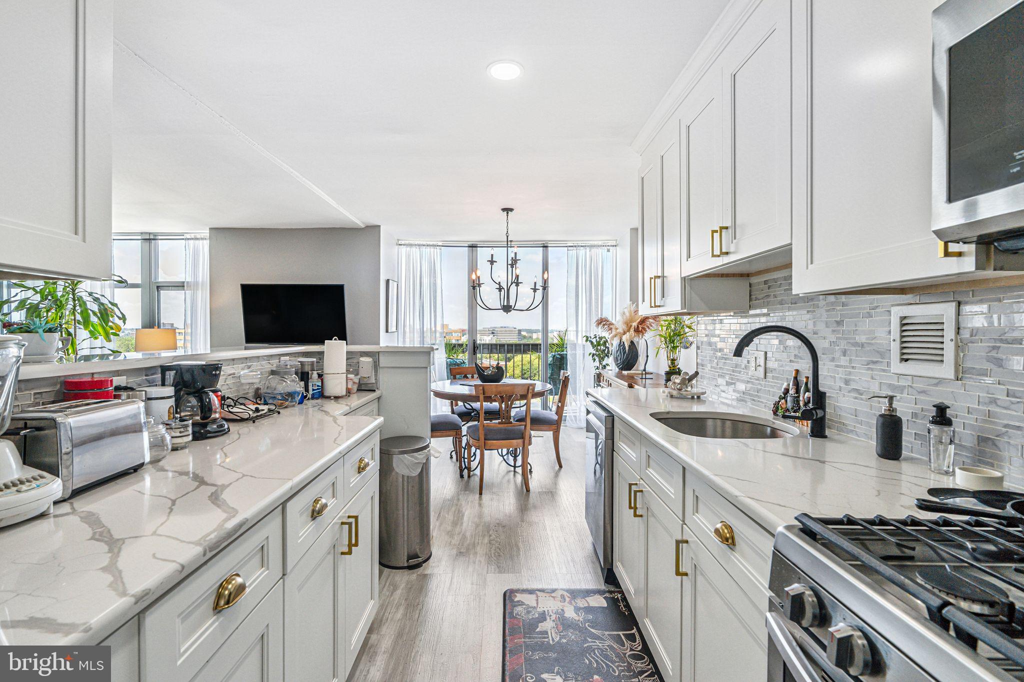 3600 Conshohocken Avenue, Unit 1712 Philadelphia, PA 19131 - Photo 11 of 27 a kitchen with cabinets a sink and appliances