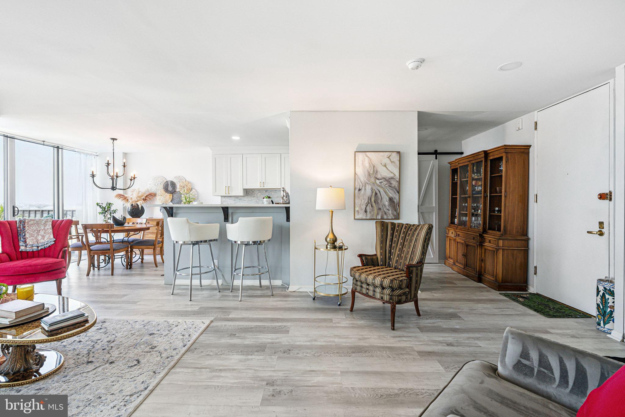 3600 Conshohocken Avenue, Unit 1712 Philadelphia, PA 19131 - Photo 22 of 27 a living room with lots of furniture and white walls