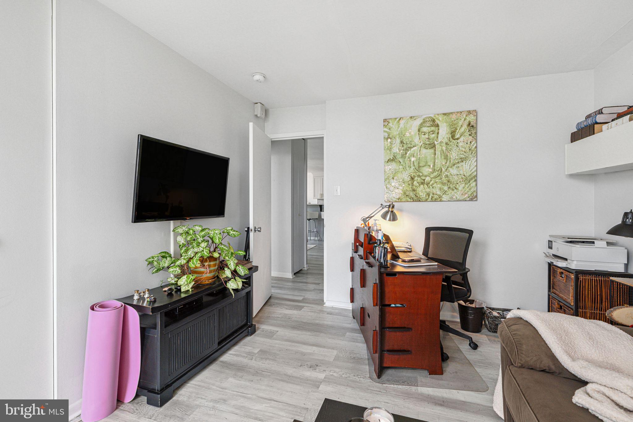 3600 Conshohocken Avenue, Unit 1712 Philadelphia, PA 19131 - Photo 24 of 27 a living room with furniture and a flat screen tv