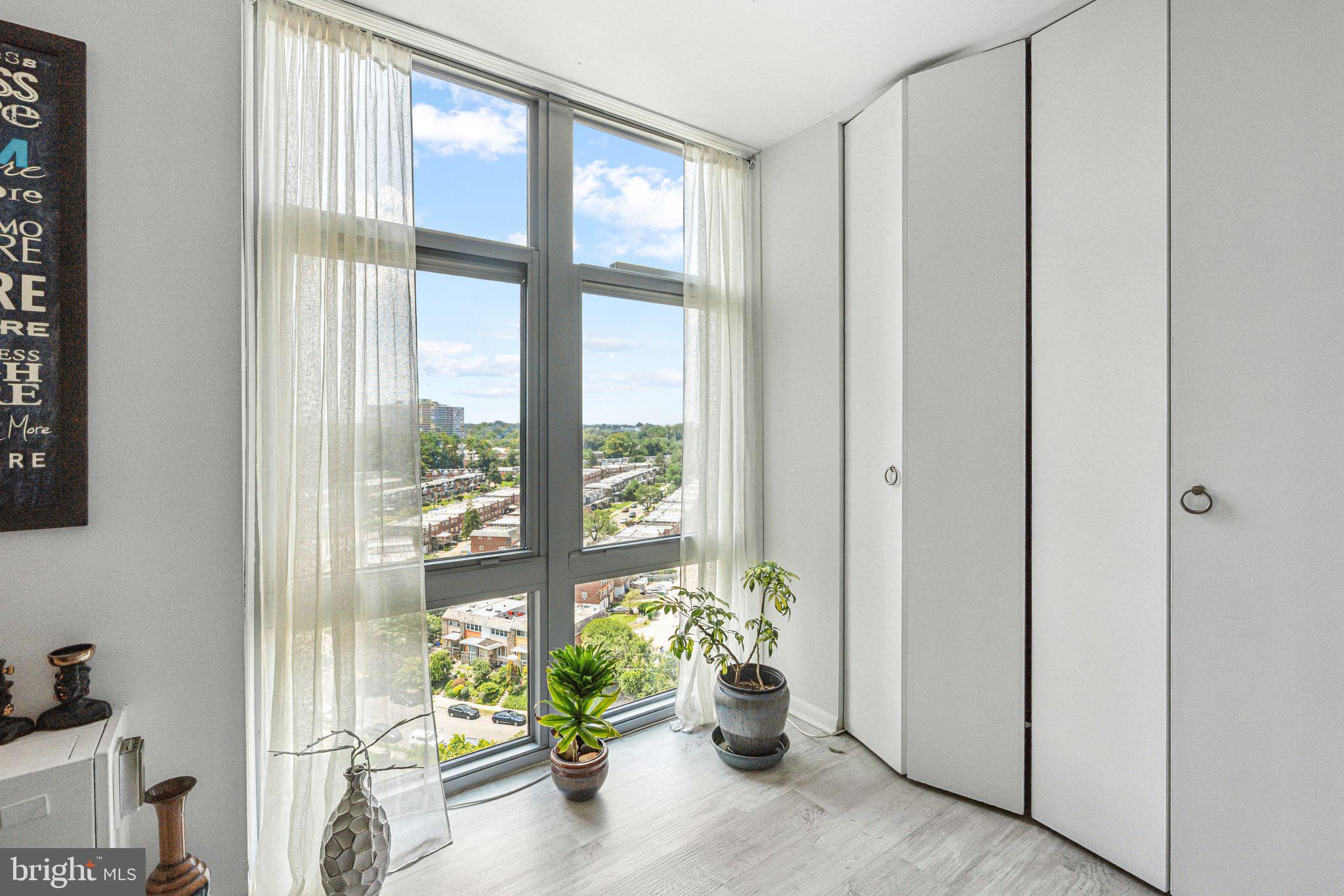 3600 Conshohocken Avenue, Unit 1712 Philadelphia, PA 19131 - Photo 26 of 27 a view of an entryway with wooden floor and a potted plant