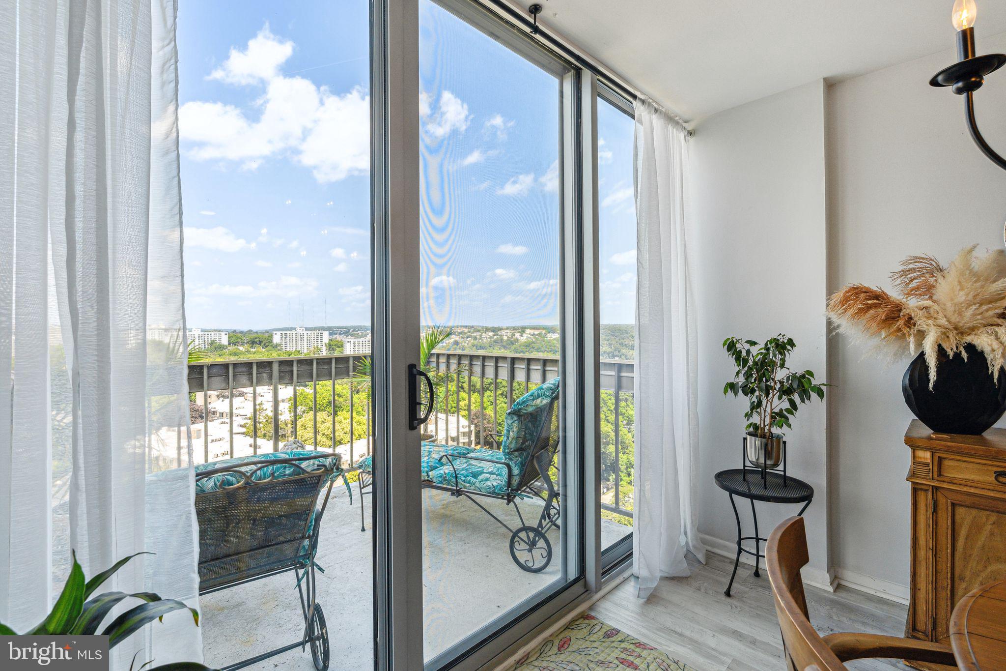 3600 Conshohocken Avenue, Unit 1712 Philadelphia, PA 19131 - Photo 6 of 27 a dining room with furniture water view and a potted plant