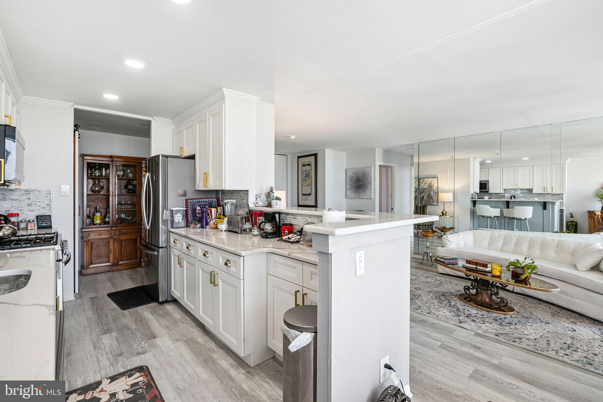 3600 Conshohocken Avenue, Unit 1712 Philadelphia, PA 19131 - Photo 8 of 27 a kitchen with refrigerator and cabinets