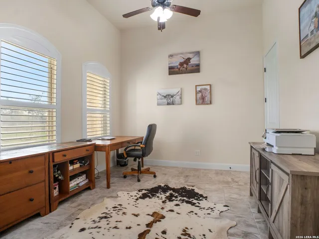 a workspace with furniture and window