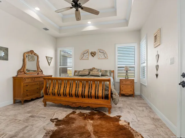 a bedroom with furniture and a window