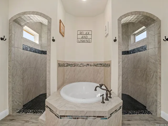 a kitchen with stainless steel appliances granite countertop a stove and cabinets