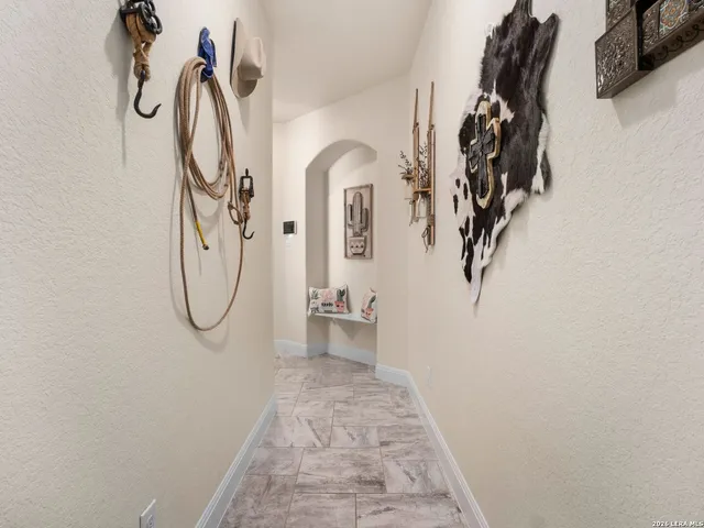 a bed sitting in a bedroom next to a window