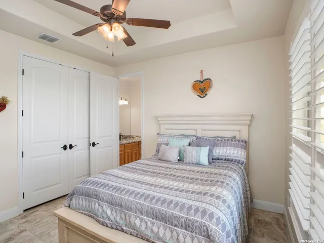 a bedroom with furniture and a window