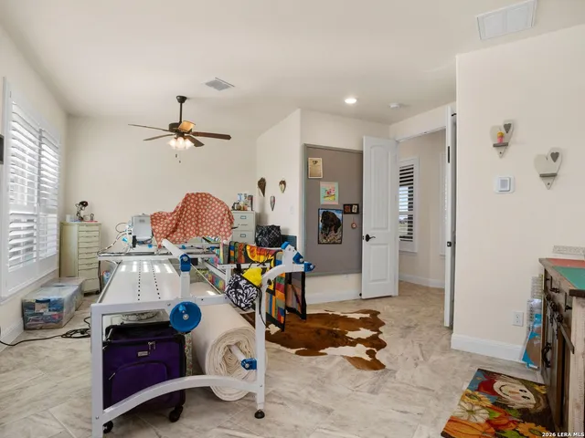 a bedroom with a bed dresser and a window