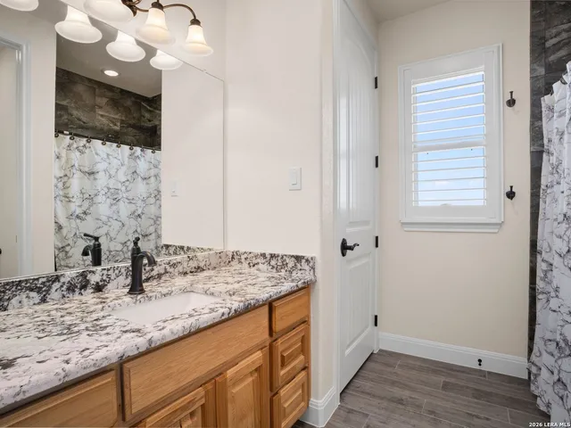 an aerial view of a house with outdoor space