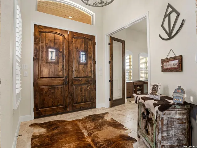 a bedroom with a bed and a mirror