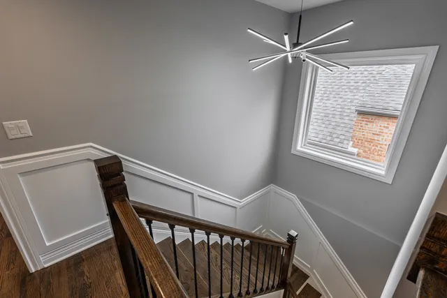 a view of entryway with a window and a ceiling fan