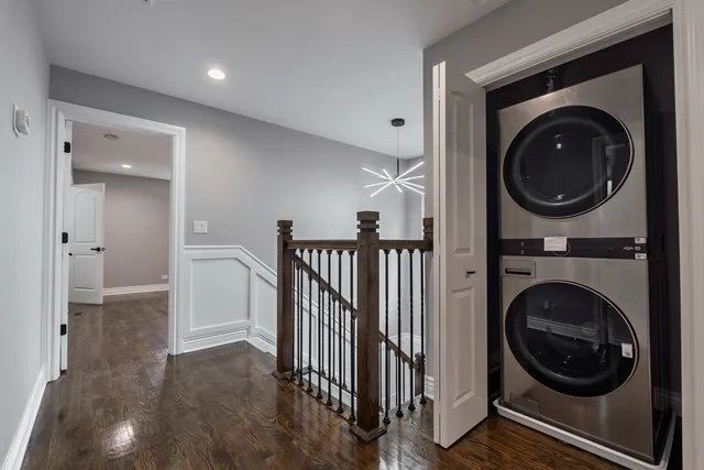 a view of a hallway with washer and dryer