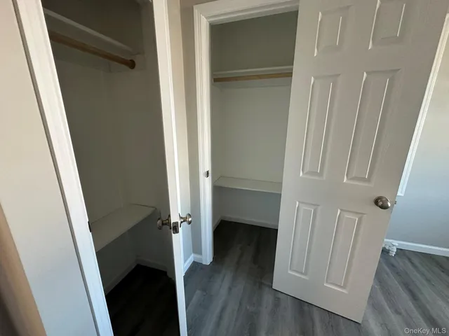 a view of utility room with wooden floor