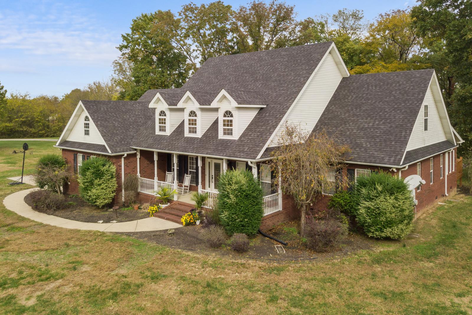 628 Rocky Valley Road Lebanon, TN 37090 - Photo 2 of 30 a front view of a house with a garden and plants