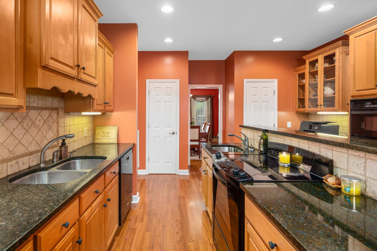 628 Rocky Valley Road Lebanon, TN 37090 - Photo 12 of 30 a kitchen with stainless steel appliances granite countertop a sink stove and cabinets
