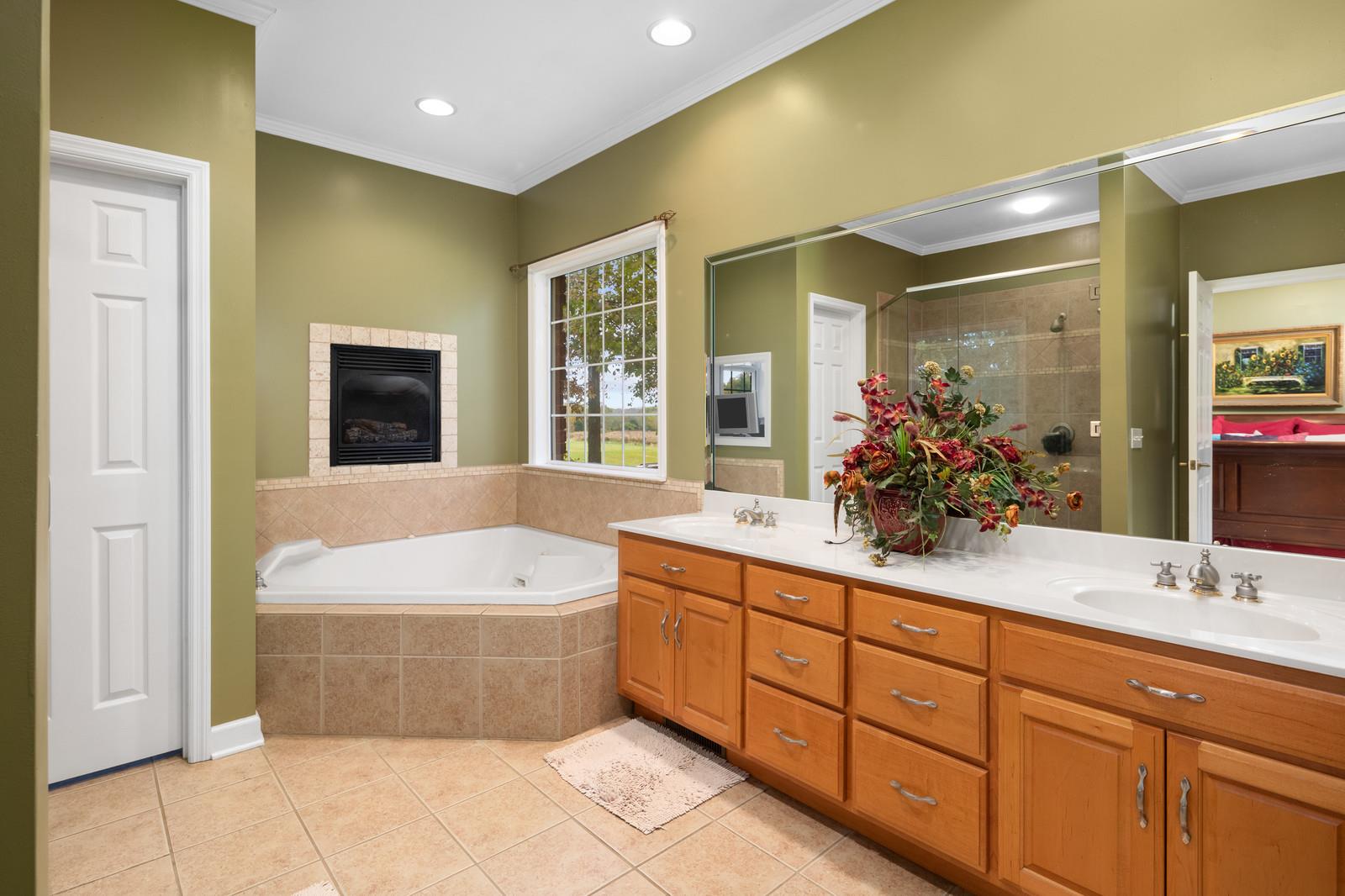 628 Rocky Valley Road Lebanon, TN 37090 - Photo 15 of 30 a spacious bathroom with a tub sink and mirror