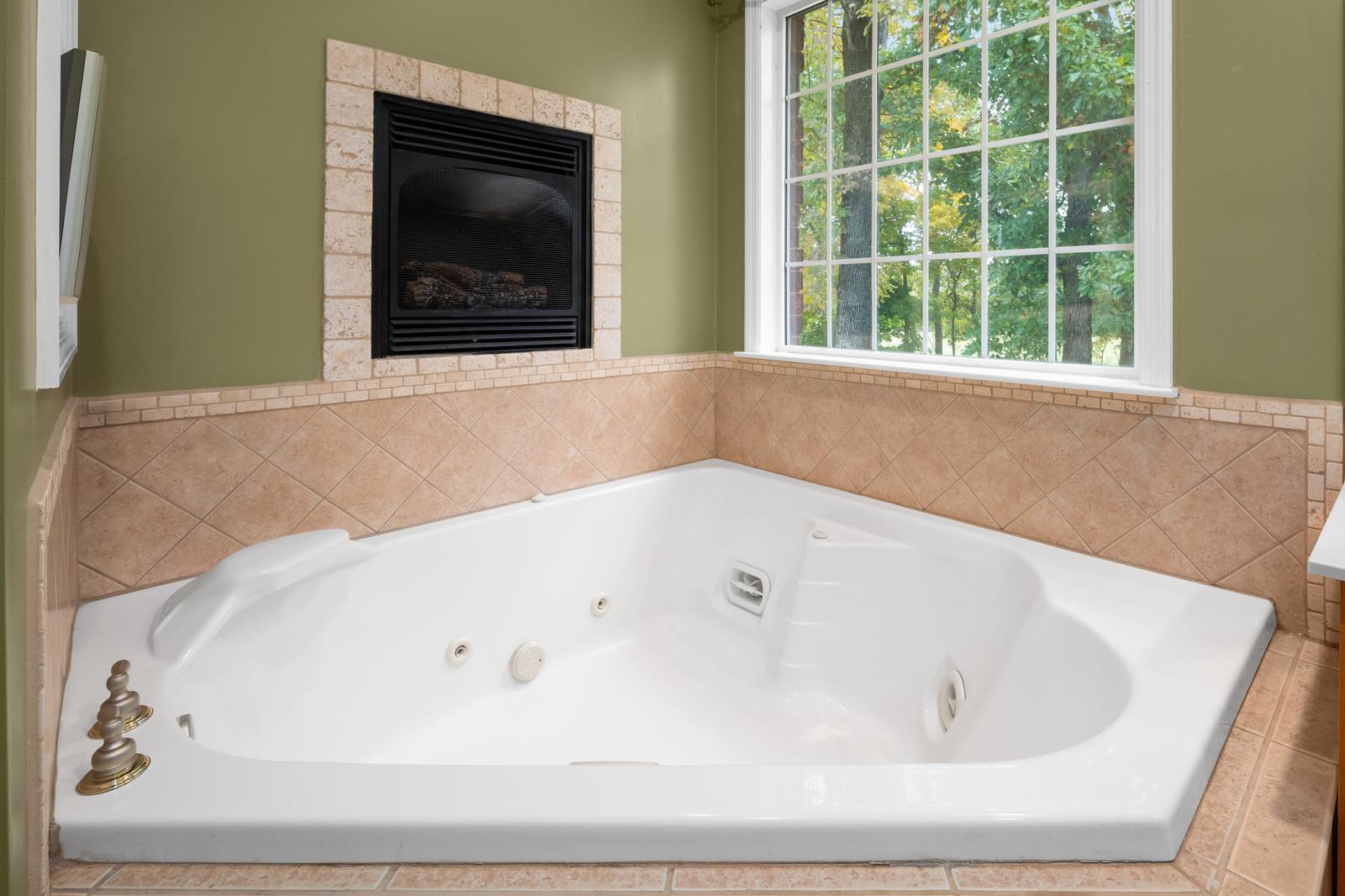 628 Rocky Valley Road Lebanon, TN 37090 - Photo 16 of 30 a bathroom with a bathtub and a window