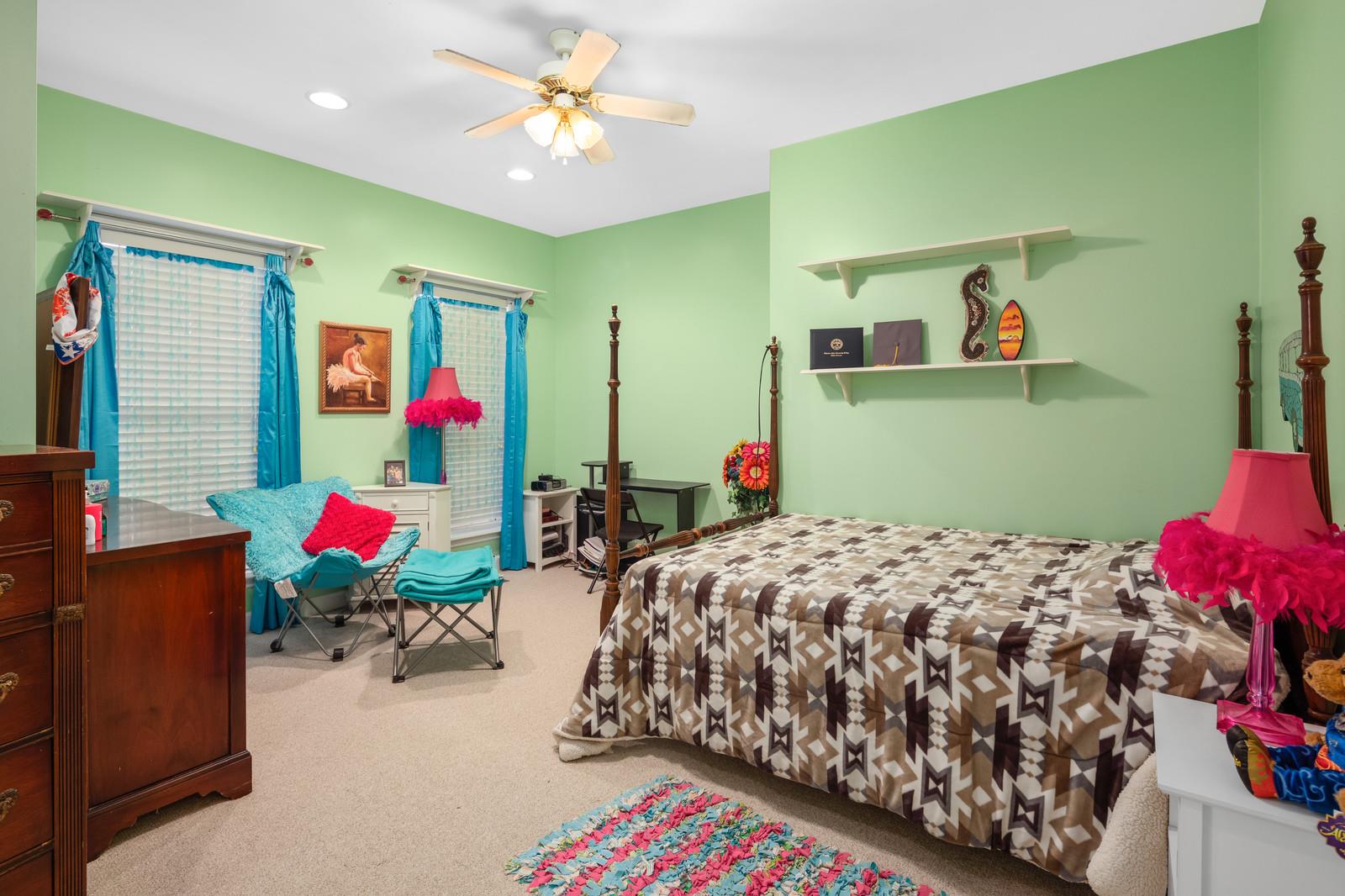 628 Rocky Valley Road Lebanon, TN 37090 - Photo 22 of 30 a bedroom with a bed dresser and a large mirror