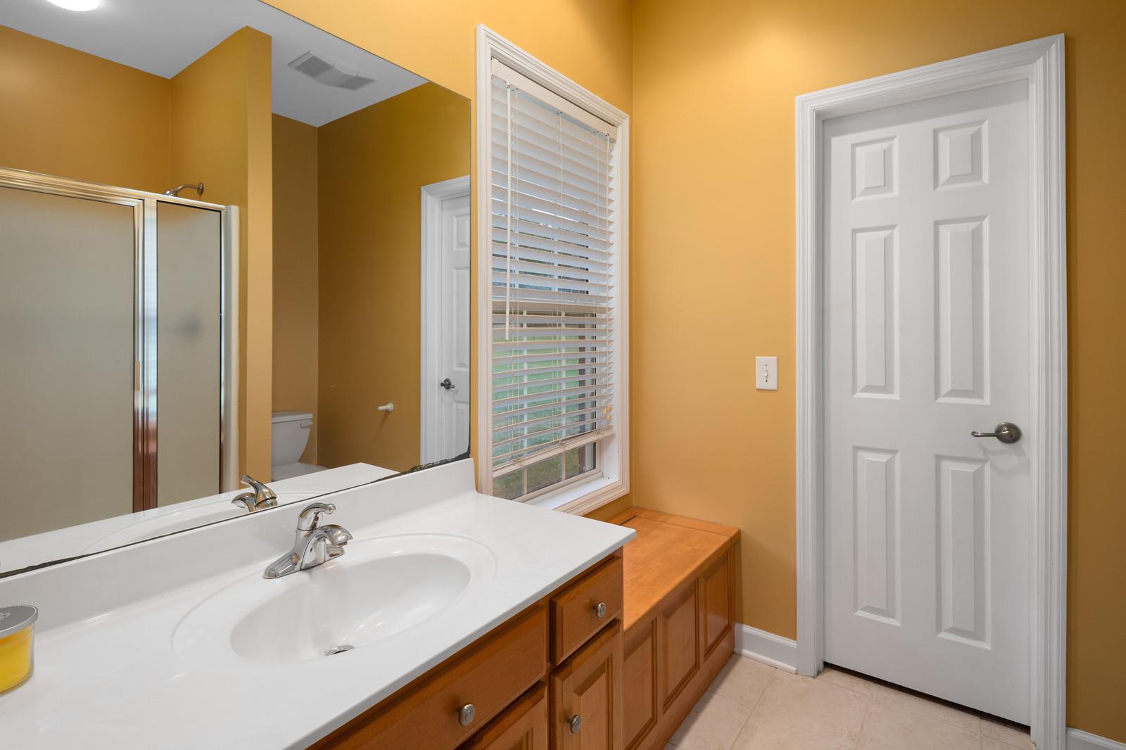 628 Rocky Valley Road Lebanon, TN 37090 - Photo 24 of 30 a bathroom with a sink and a mirror