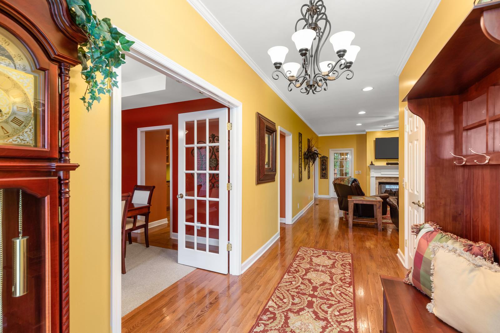 628 Rocky Valley Road Lebanon, TN 37090 - Photo 5 of 30 a view of a dining room with furniture a chandelier and wooden floor