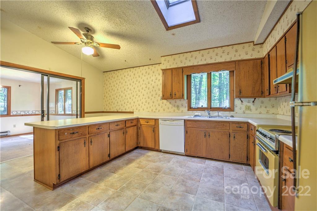 177 Weston Road Arden, NC 28704 - Photo 11 of 36 a large kitchen with a large window