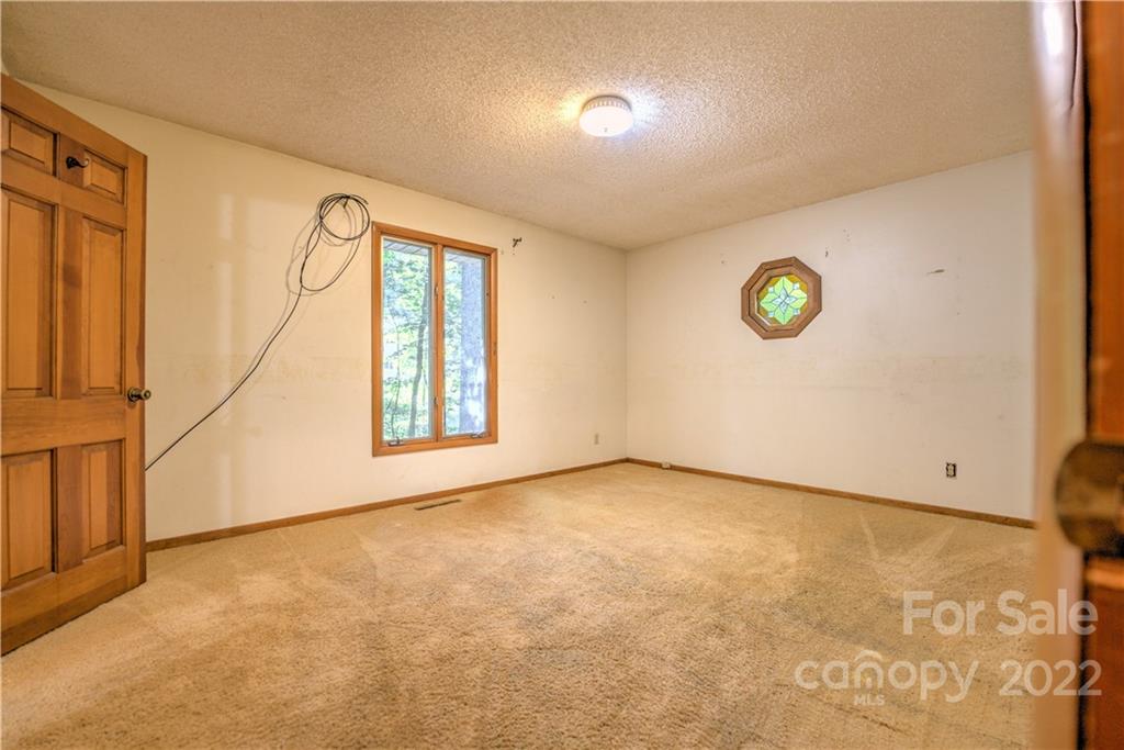 177 Weston Road Arden, NC 28704 - Photo 16 of 36 an empty room with windows