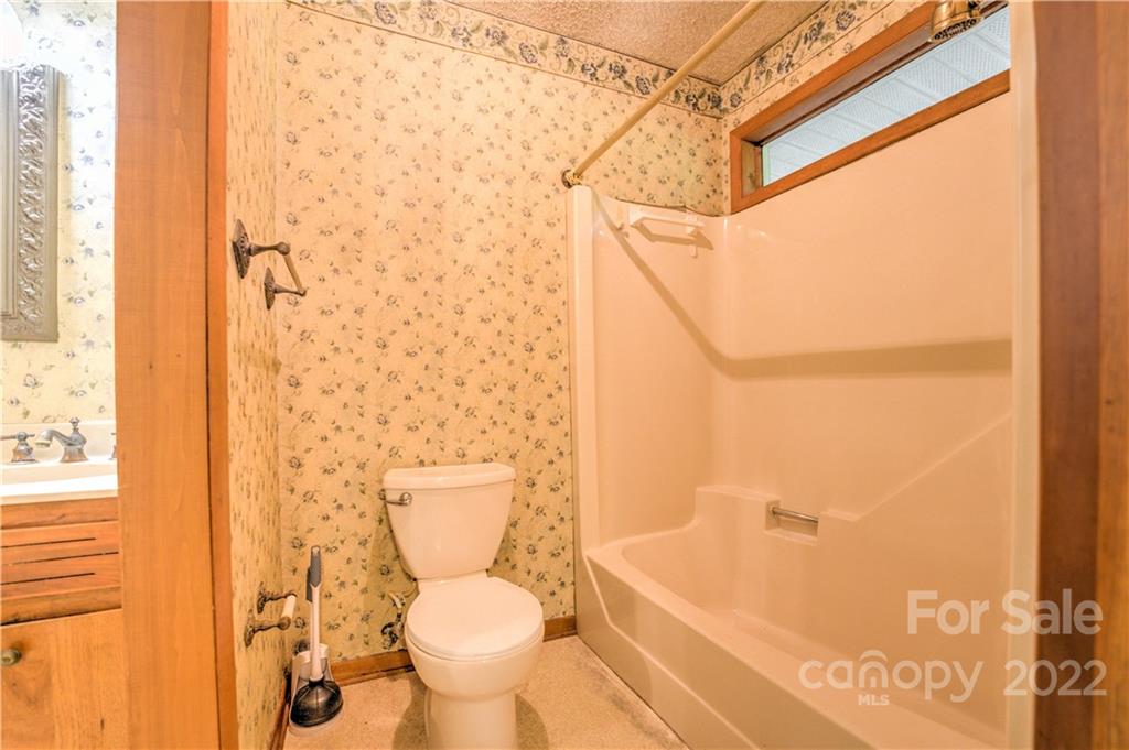 177 Weston Road Arden, NC 28704 - Photo 20 of 36 a bathroom with a toilet and a shower
