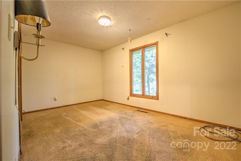 177 Weston Road Arden, NC 28704 - Photo 21 of 36 a view of an empty room with a window