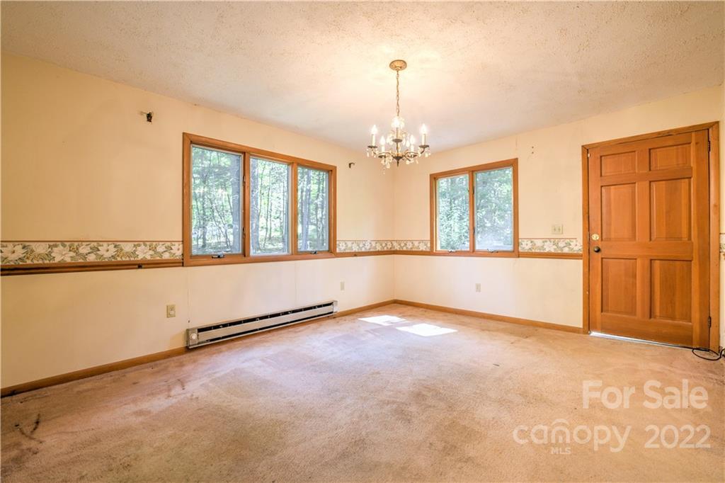177 Weston Road Arden, NC 28704 - Photo 22 of 36 a view of an empty room with a window