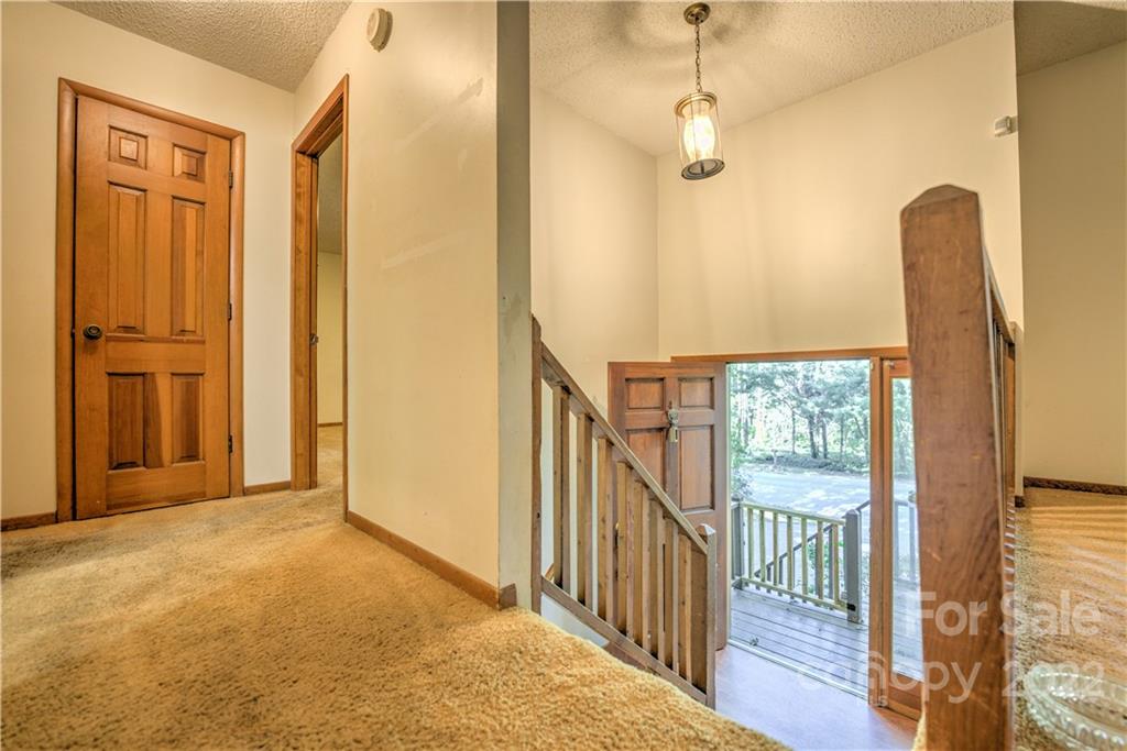 177 Weston Road Arden, NC 28704 - Photo 23 of 36 a view of a hallway with wooden floor and entryway