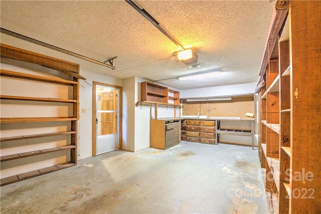 177 Weston Road Arden, NC 28704 - Photo 30 of 36 a view of empty room with wooden floor and windows