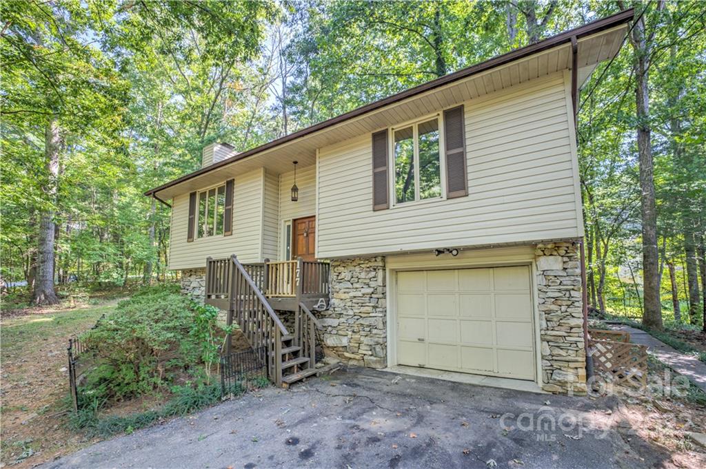 177 Weston Road Arden, NC 28704 - Photo 31 of 36 a view of a house with a yard and garage