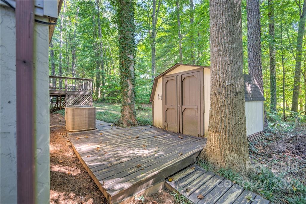 177 Weston Road Arden, NC 28704 - Photo 33 of 36 a view of a wooden door and a yard