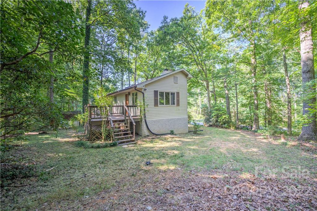 177 Weston Road Arden, NC 28704 - Photo 36 of 36 a view of a small house with a tree in the yard
