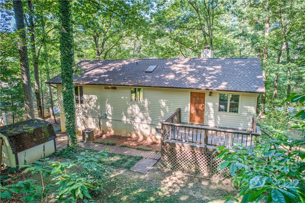 177 Weston Road Arden, NC 28704 - Photo 4 of 36 a view of house with a yard and outdoor seating