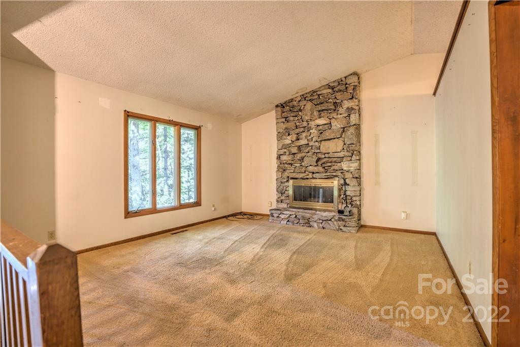 177 Weston Road Arden, NC 28704 - Photo 6 of 36 a view of an empty room with a fireplace