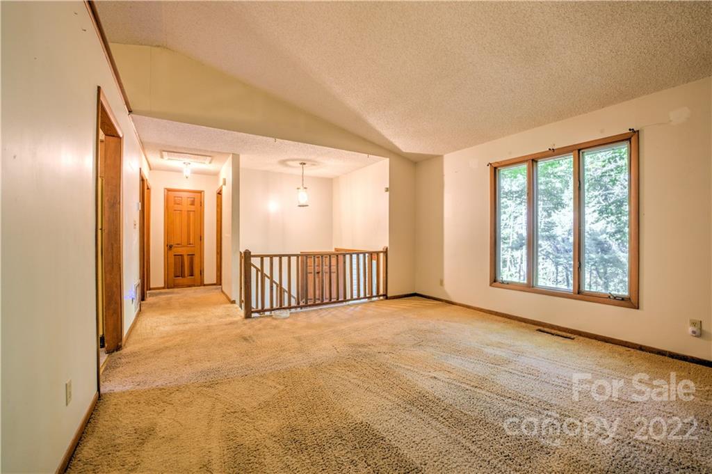 177 Weston Road Arden, NC 28704 - Photo 8 of 36 a view of a big room with windows and entryway