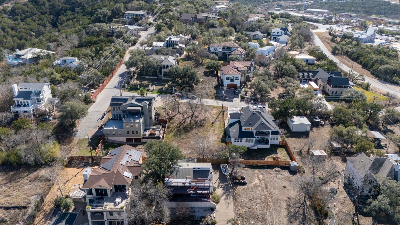 12802 Thomas Street Austin, TX 78732 - Photo 20 of 31 an aerial view of multiple houses with yard