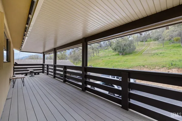 a view of outdoor space with garden and deck