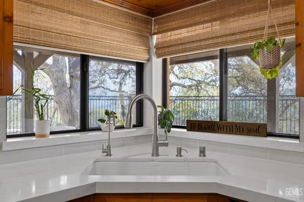 a bathroom with a sink and a large window