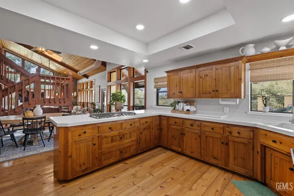 a large kitchen with wooden cabinets