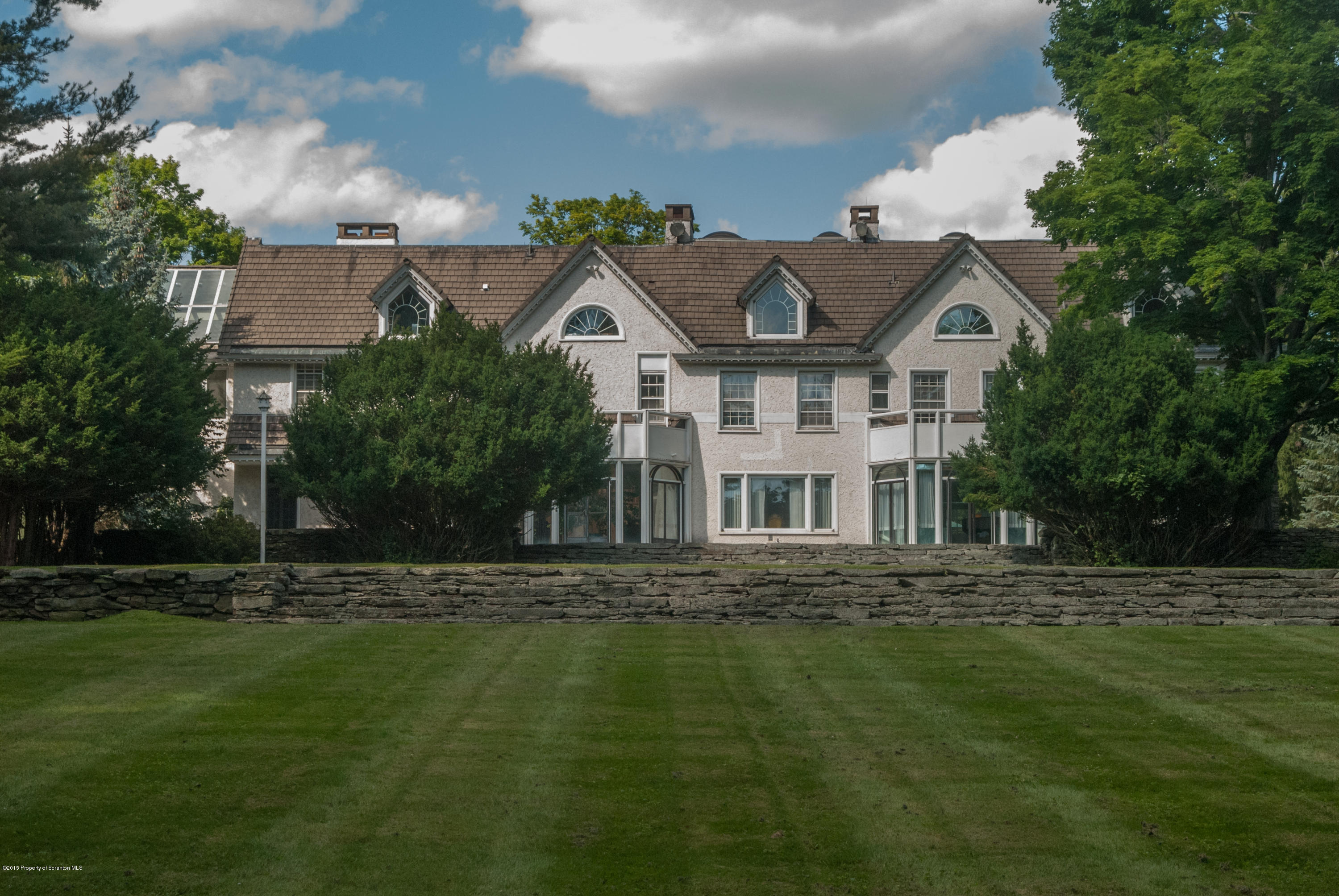 145 Carbondale Road Waverly, PA 18471 - Photo 2 of 98 a front view of a house with a garden
