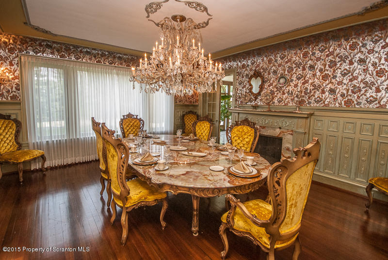 145 Carbondale Road Waverly, PA 18471 - Photo 21 of 98 a view of a dining room with furniture wooden floor and chandelier